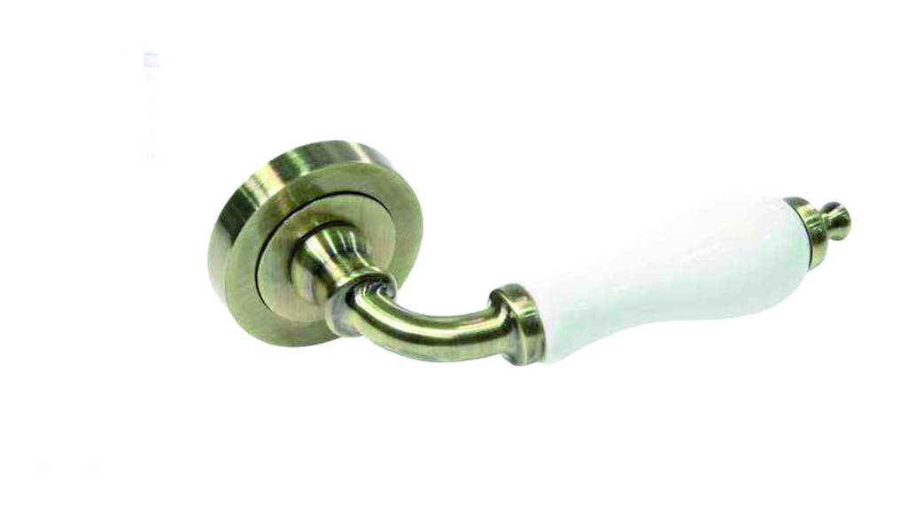 Jgo. manetas porcelana blanca placa Ø 52 mm. bronce